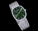 Green dial 5738 watch with silver-tone chain-link bracelet - angled view